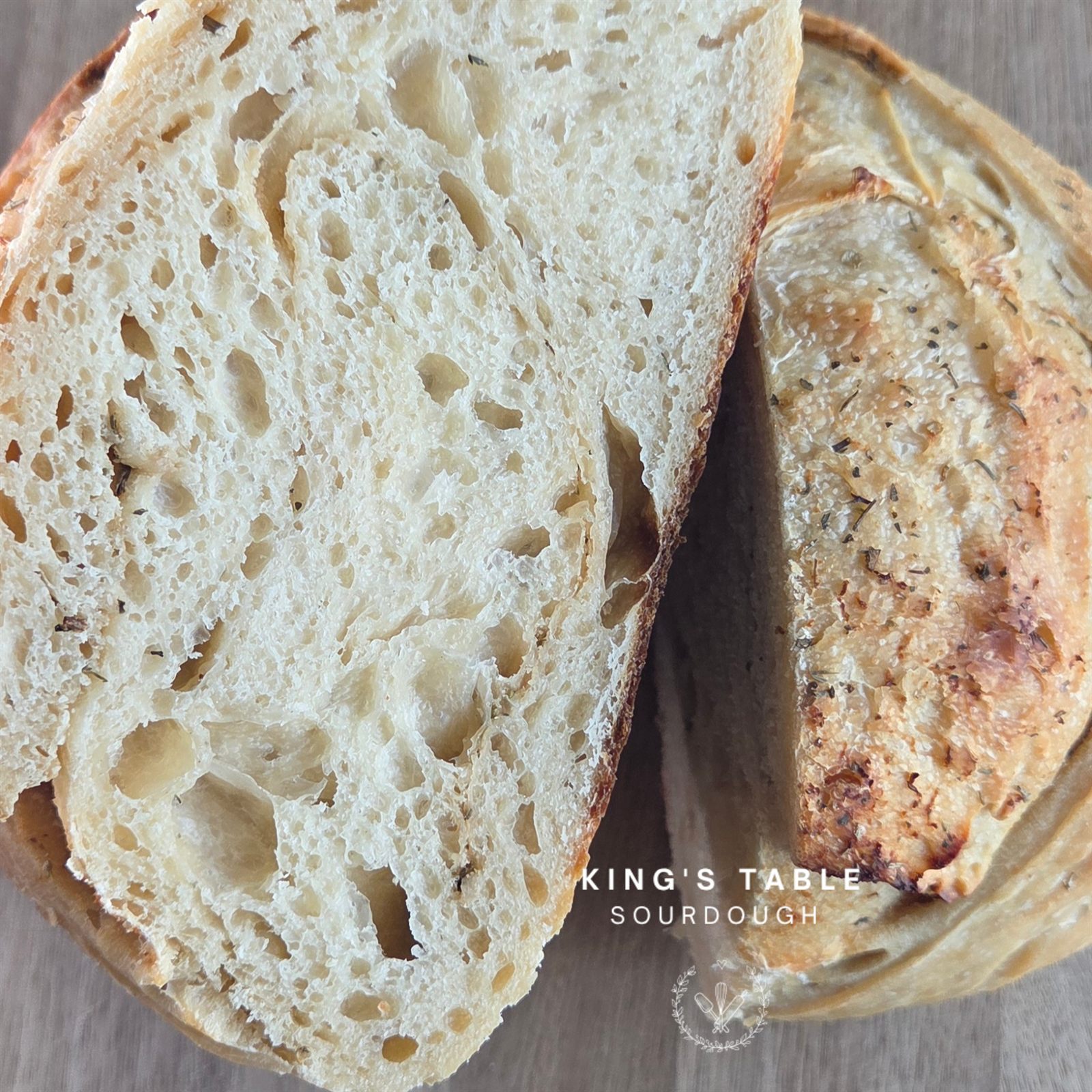 Sliced classic sourdough loaf with an open airy crumb