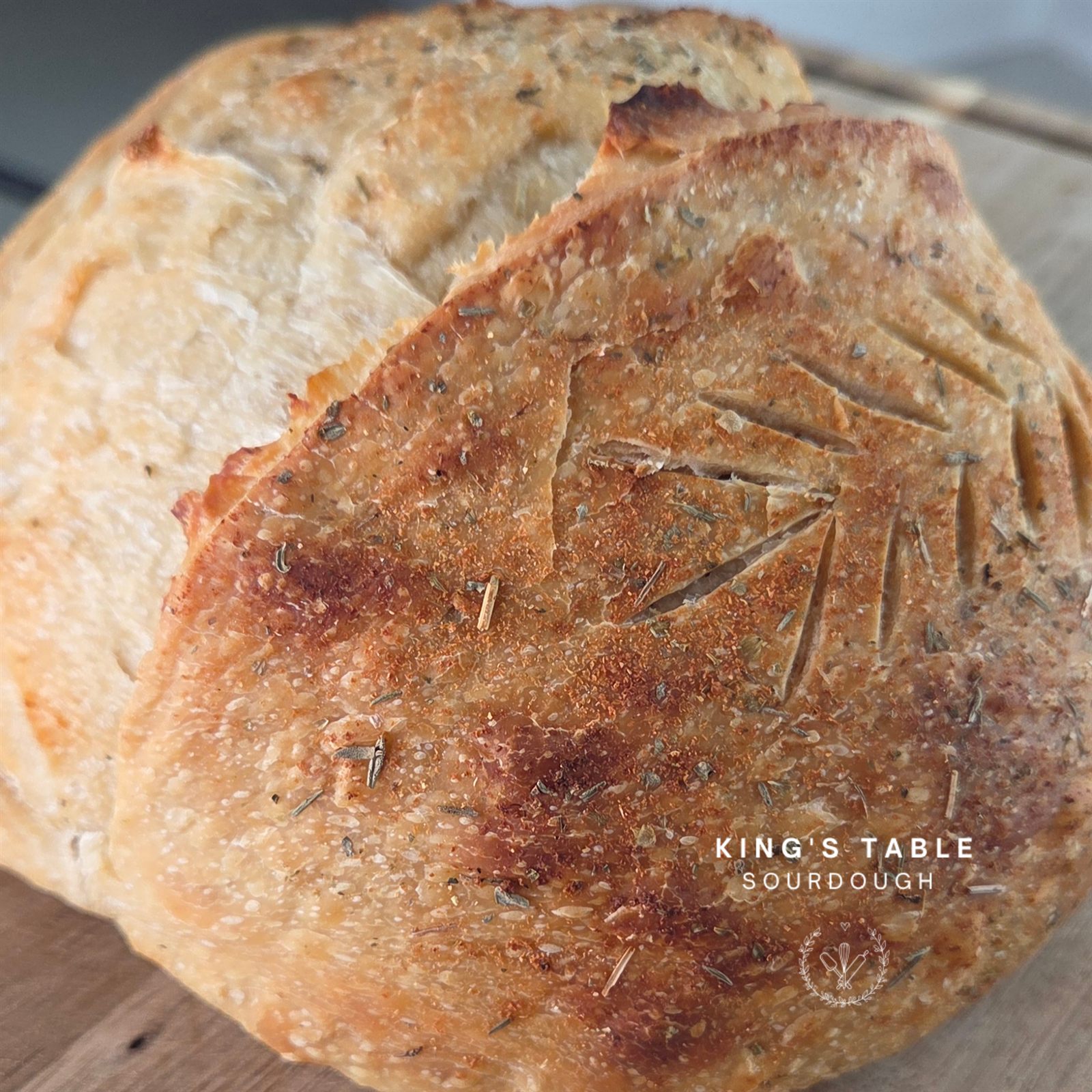Garlic and Italian herbs sourdough boule with a seasoned crust