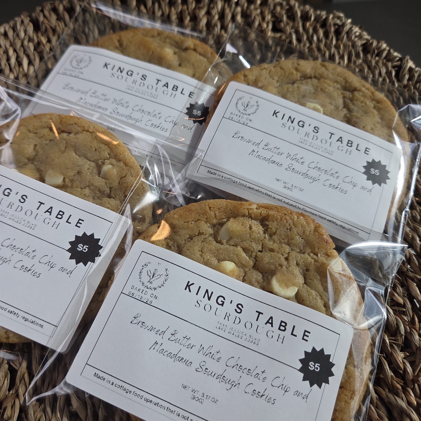 Browned butter white chocolate and macadamia sourdough cookies in packaging
